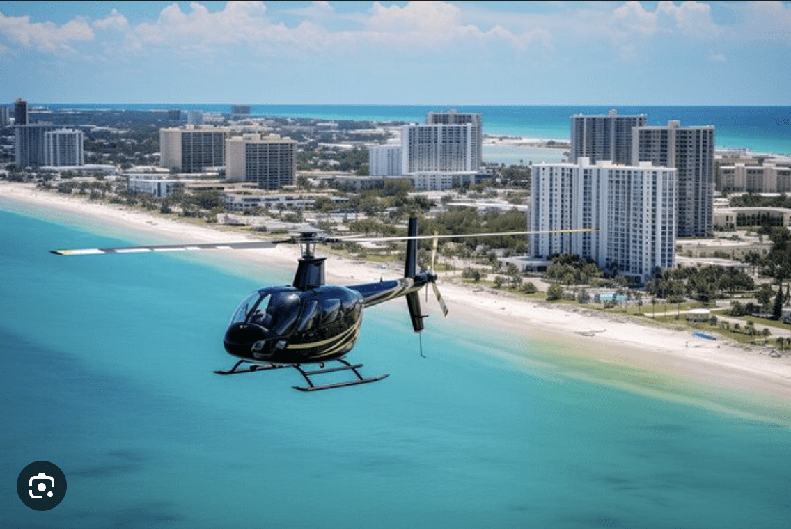 Helicopter tour flying over the turquoise waters and beaches of Clearwater Beach, Florida.