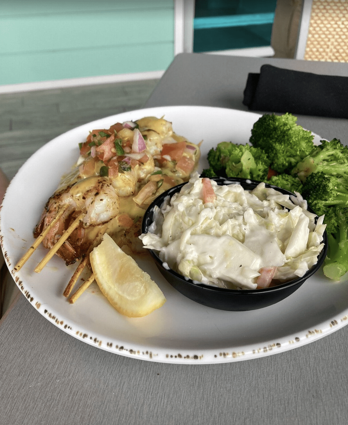 Grilled shrimp skewers topped with pico de gallo, served with creamy coleslaw and steamed broccoli.
